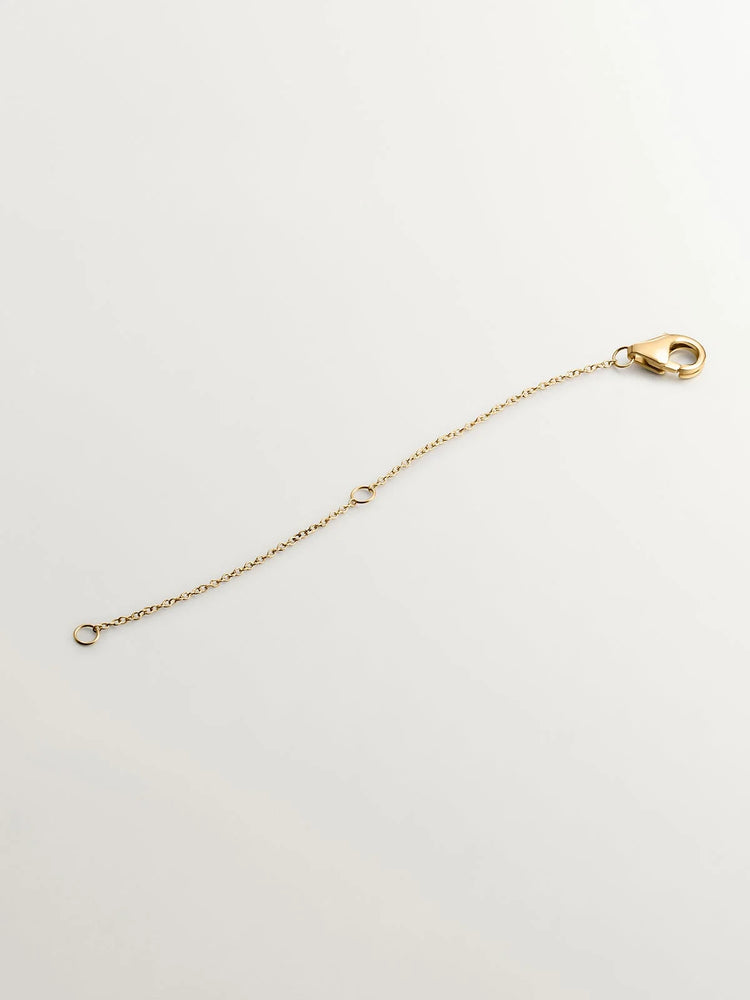 Alargador de oro amarillo de 18K