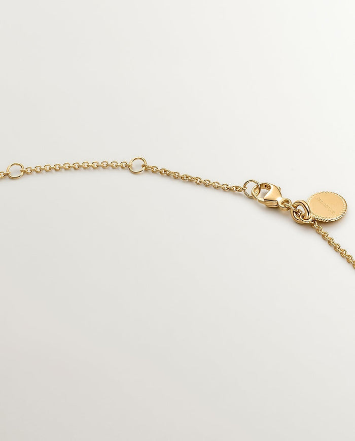 Colgante de plata 925 bañada en oro amarillo de 18K con cruz pequeña y espinelas