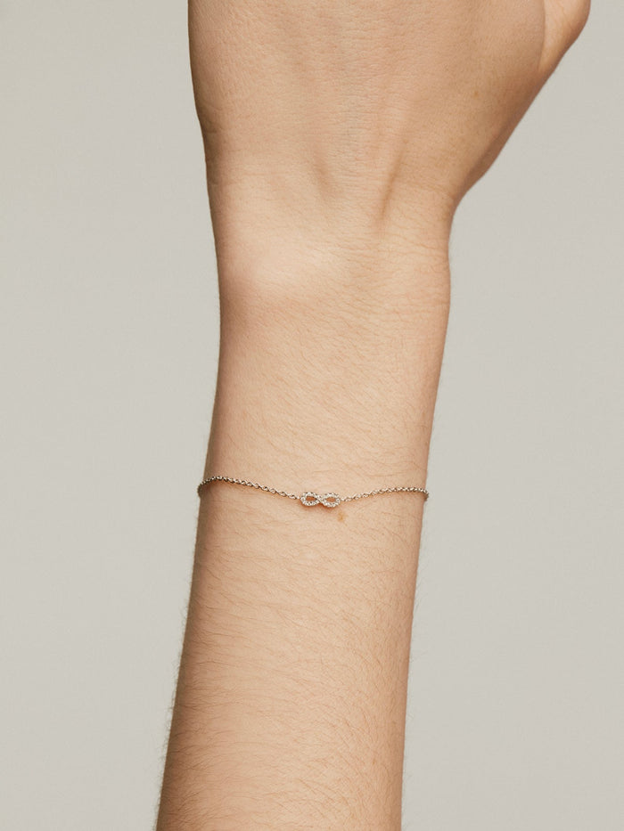 Pulsera infinito diamantes 0,05 ct  oro blanco