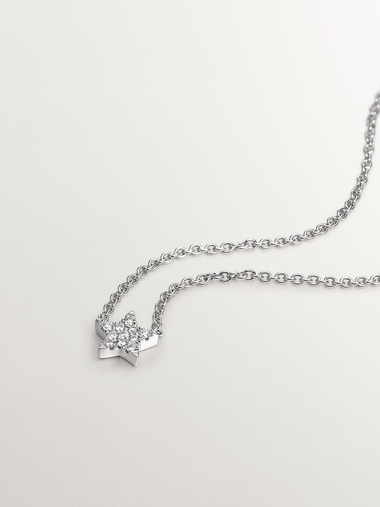 Colgante estrella diamantes 0,06 ct  oro blanco
