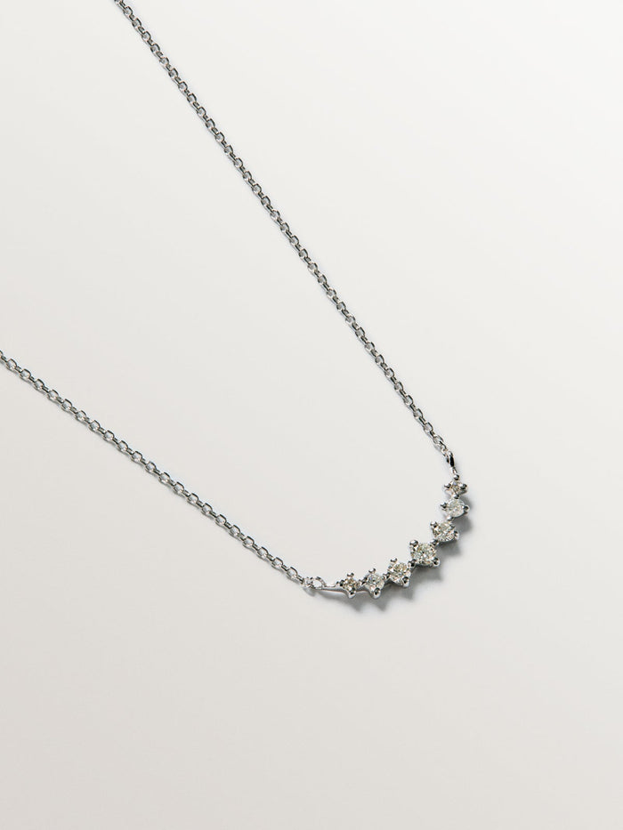Colgante siente diamantes 0,15 ct  oro blanco