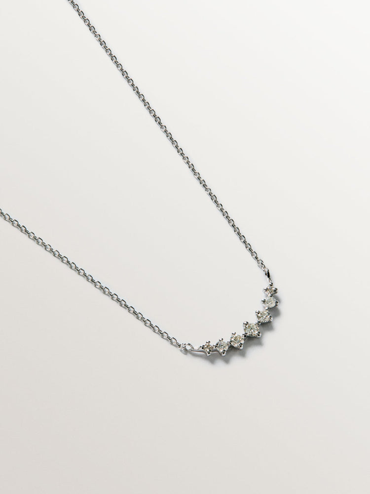 Colgante siente diamantes 0,15 ct  oro blanco