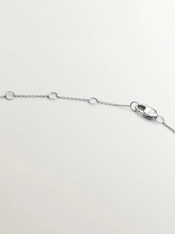 Colgante de oro blanco de 18K con cruz con diamantes blancos