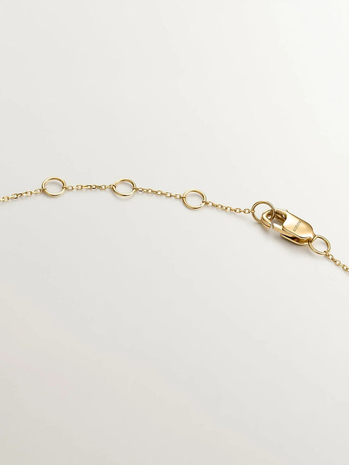 Colgante de oro amarillo de 18K con gota y diamantes en talla brillante