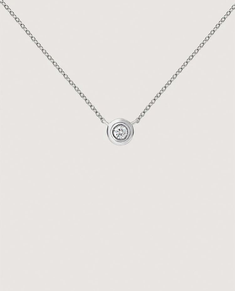 Colgante doble chatón 0,03 ct  oro blanco