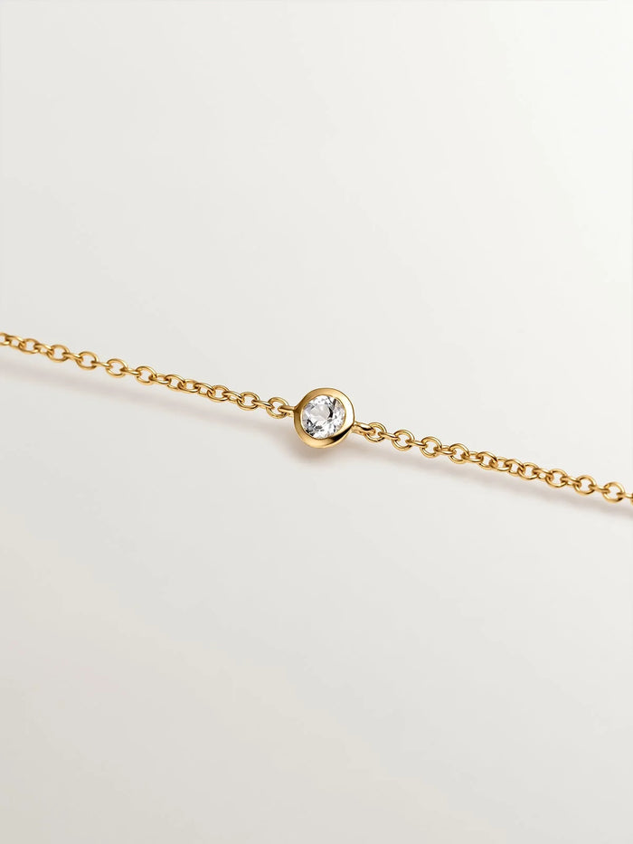 Pulsera solitario de plata 925 bañada en oro amarillo de 18K con topacio blanco