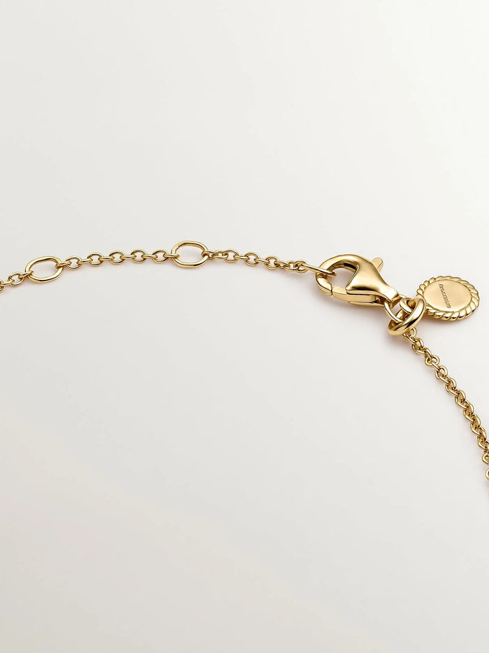 Pulsera solitario de plata 925 bañada en oro amarillo de 18K con topacio blanco