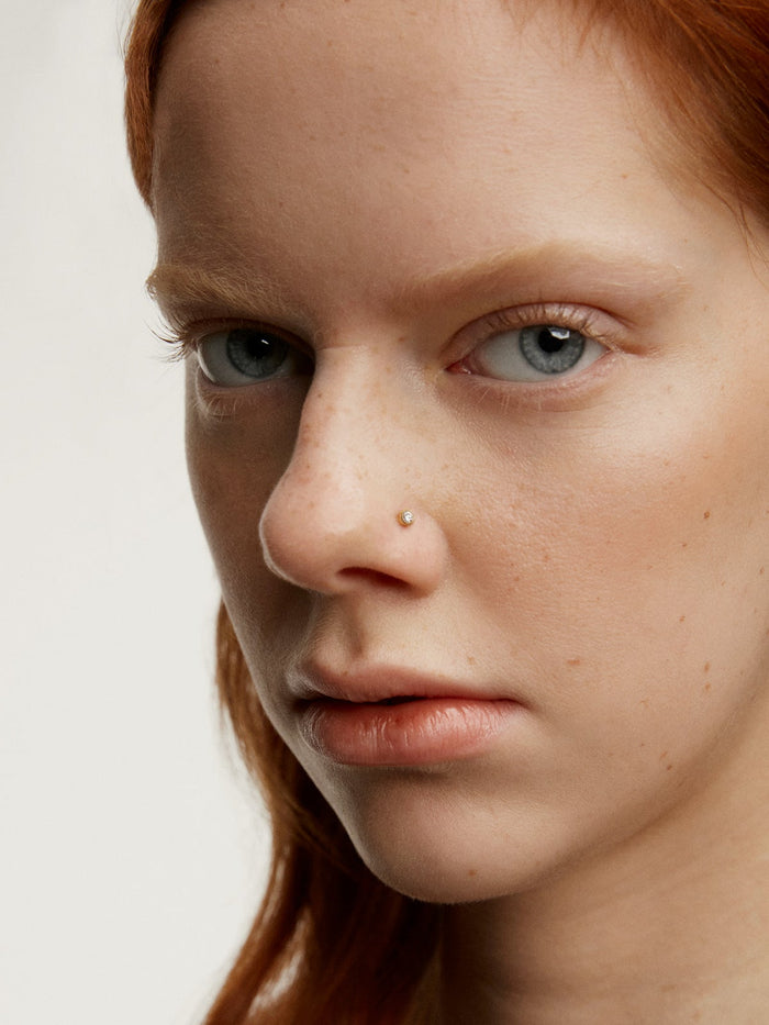 Piercing de oro amarillo de 18K con diamante 0,048 cts