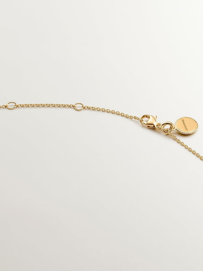 Colgante de plata 925 bañada en oro amarillo de 18K con cruz y topacios blancos