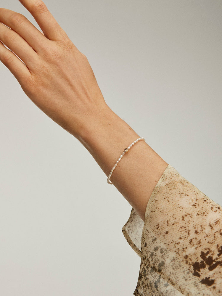 Pulsera motivo flor perla plata recubierta oro