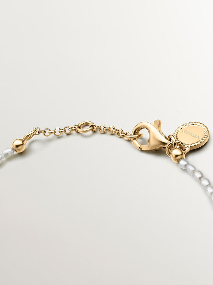 Pulsera motivo flor perla plata recubierta oro