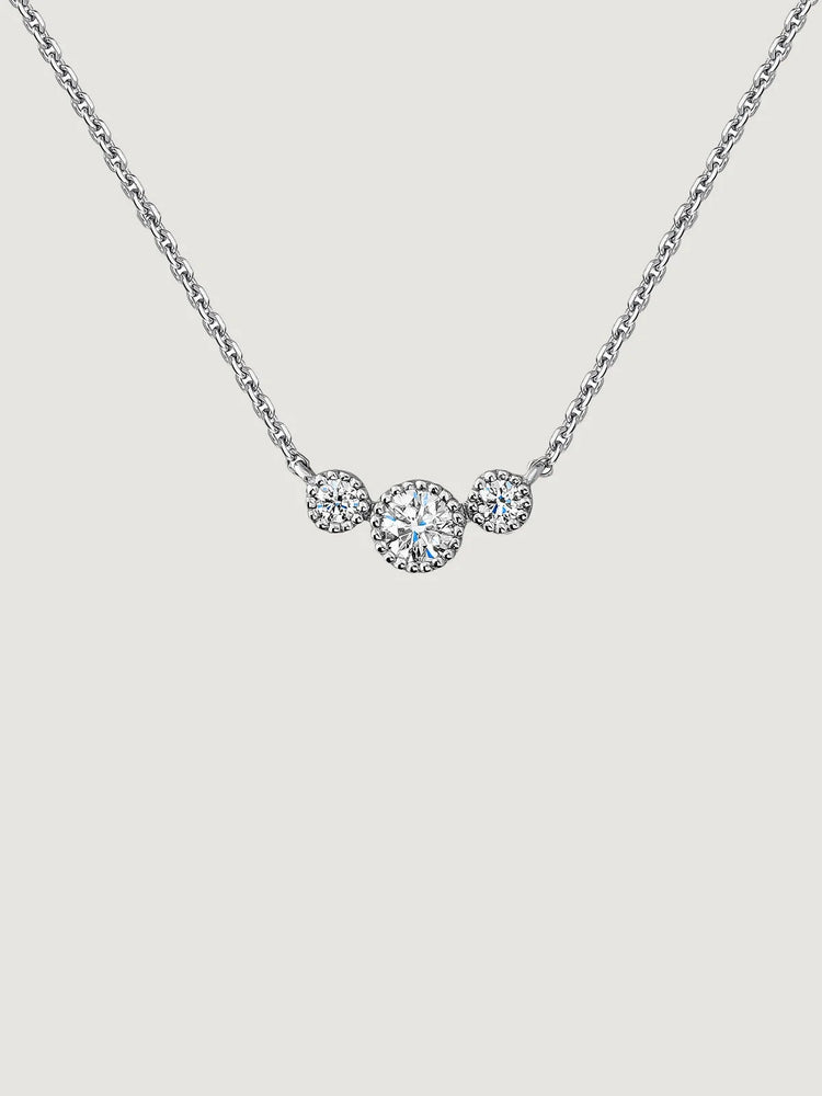 Colgante de oro blanco de 18K con triple diamante 0,097 cts