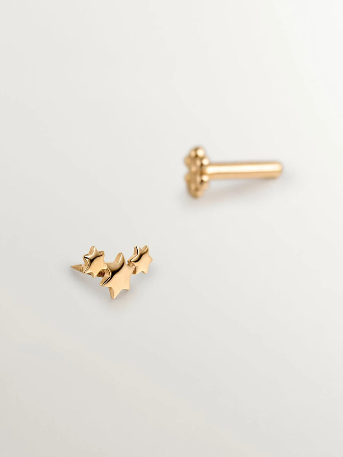 Piercing de oro amarillo de 18K con triple estrella
