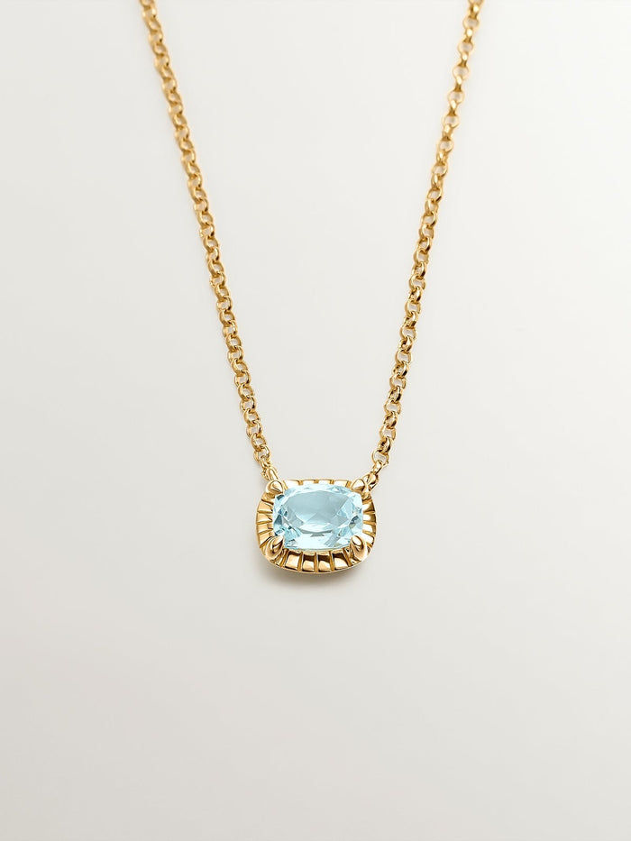 Colgante de plata 925 bañada en oro amarillo de 18K con topacio azul sky