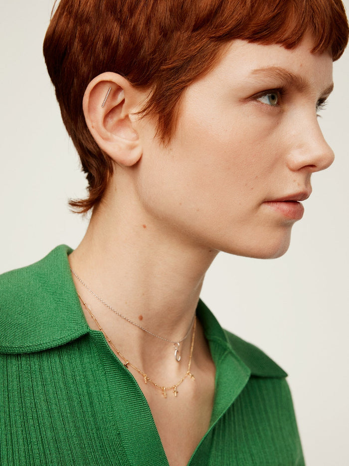 Piercing de oro blanco de 18K con diamantes