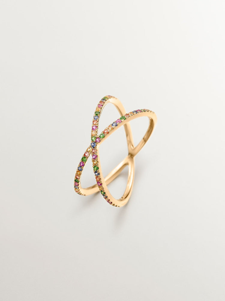 Anillo multibrazo de oro con zafiros y tsavoritas.