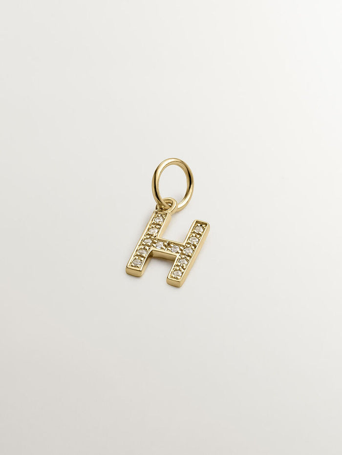 Charm letra H de plata bañada en oro de 18kt con topacios blancos