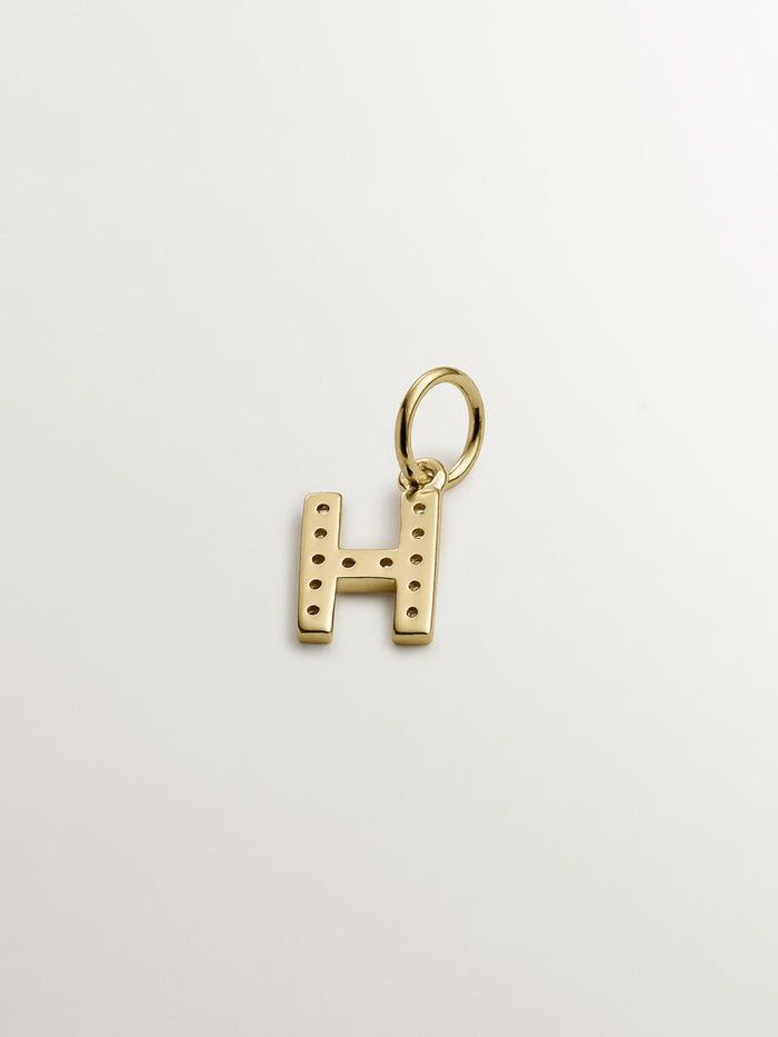 Charm letra H de plata bañada en oro de 18kt con topacios blancos