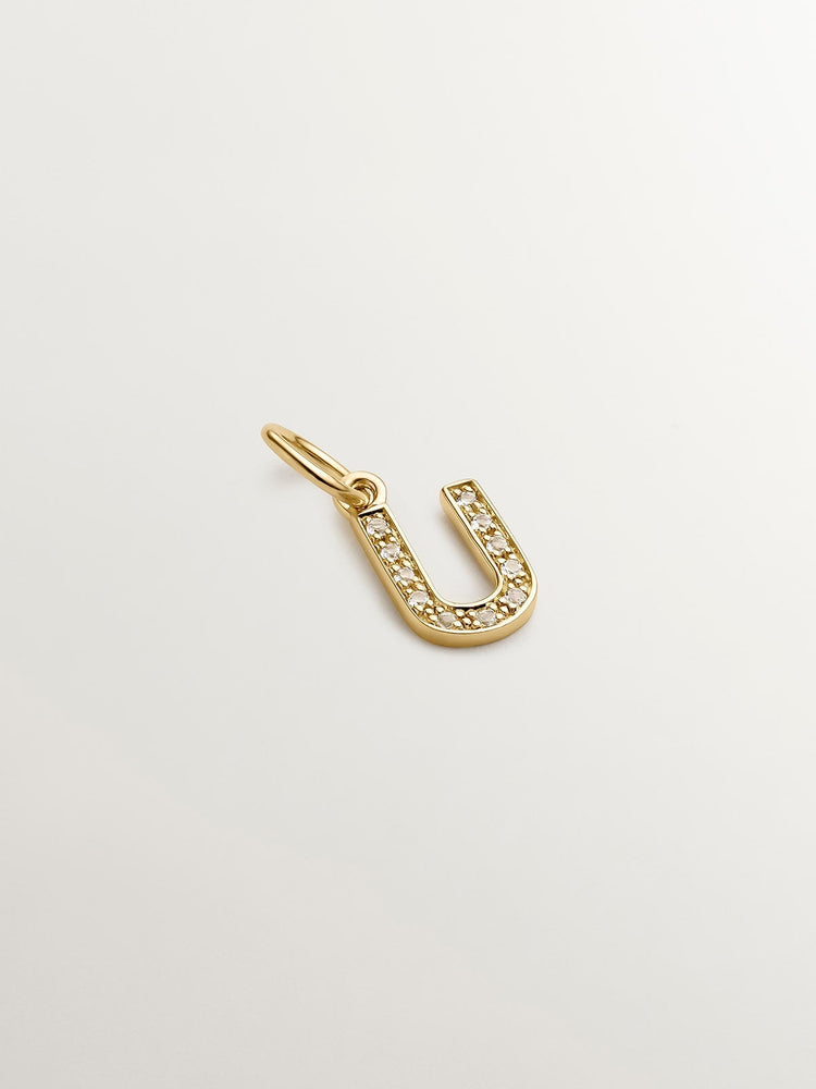 Charm de plata 925 bañada en oro amarillo de 18K y topacios blancos inicial U
