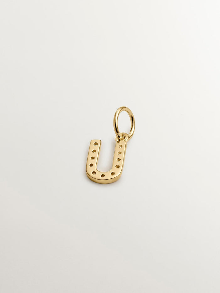 Charm de plata 925 bañada en oro amarillo de 18K y topacios blancos inicial U