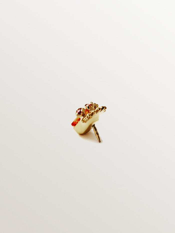Piercing de oro amarillo de 18K con zafiro naranja central y rubíes rosas