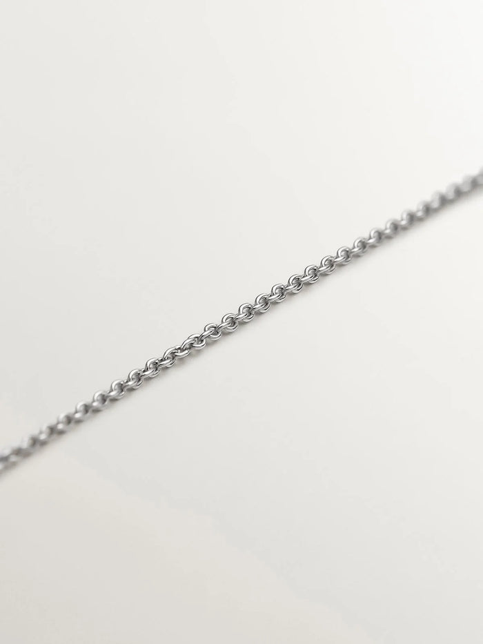 Colgante de oro blanco de 18K con tachuela y diamante