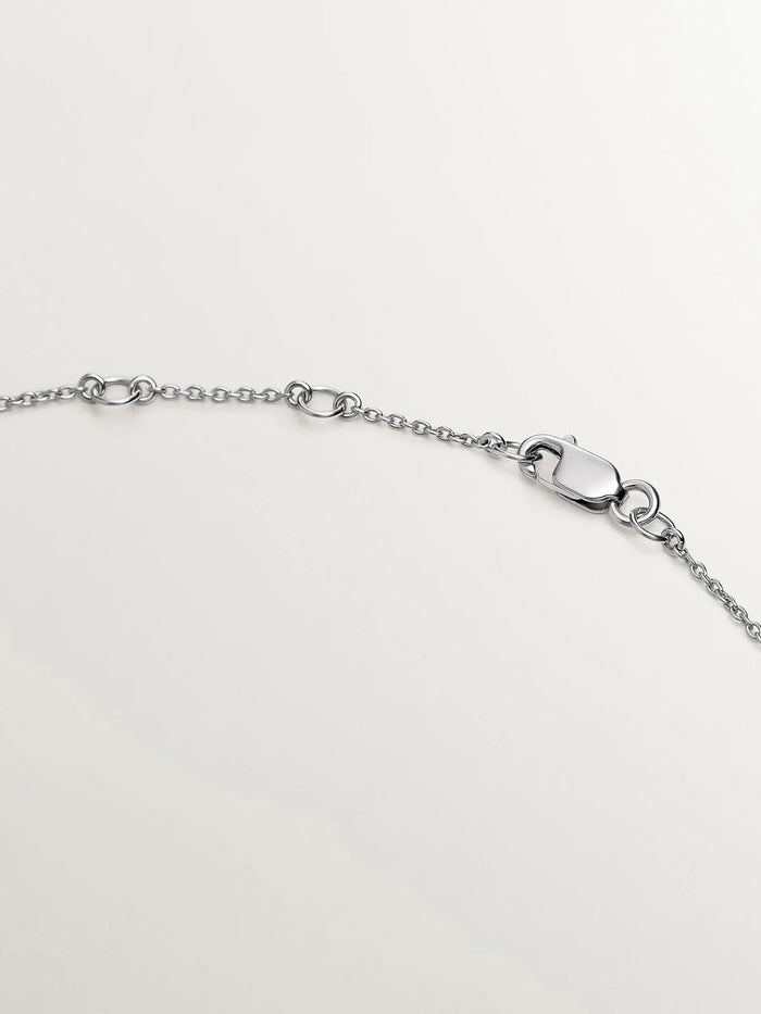Colgante de oro blanco de 18K con tachuela y diamante
