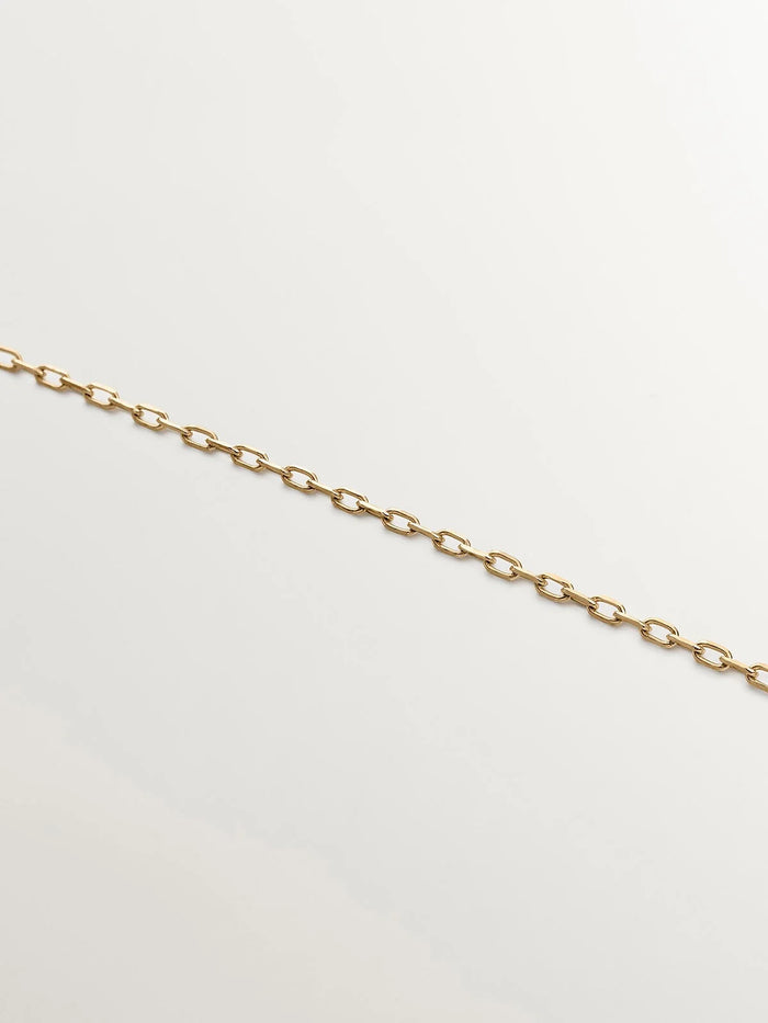 Collar de oro amarillo de 9K con obsidiana negra en talla lágrima y diamantes en talla brillante de 0,03 cts