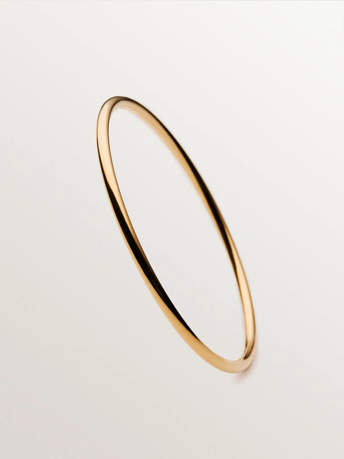 Pulsera rígida estilo semanario de plata 925 bañada en oro amarillo de 18K.