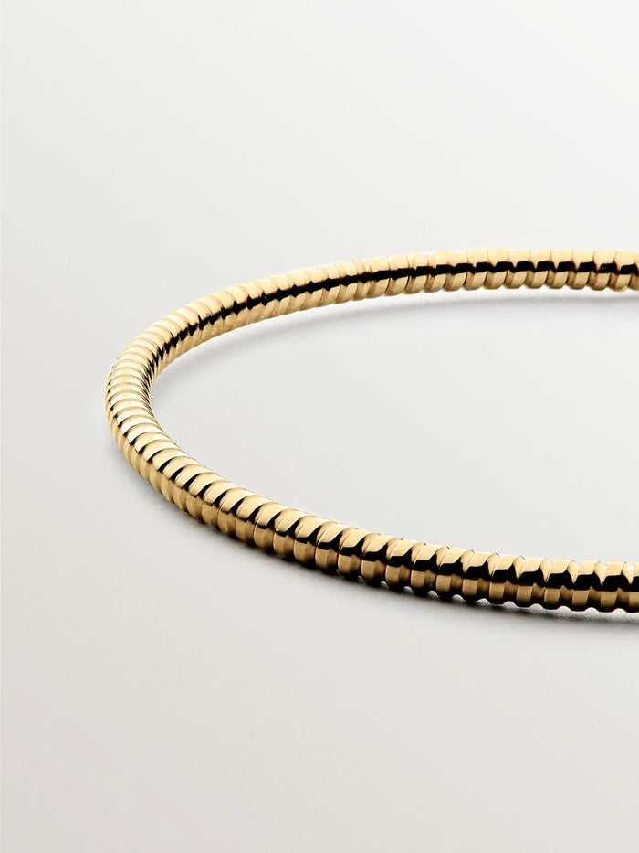 Pulsera rígida estilo semanario de plata 925 bañada en oro amarillo de 18K.
