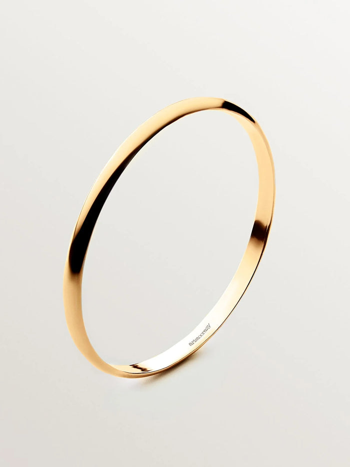 Pulsera rígida estilo semanario de plata 925 bañada en oro amarillo de 18K.