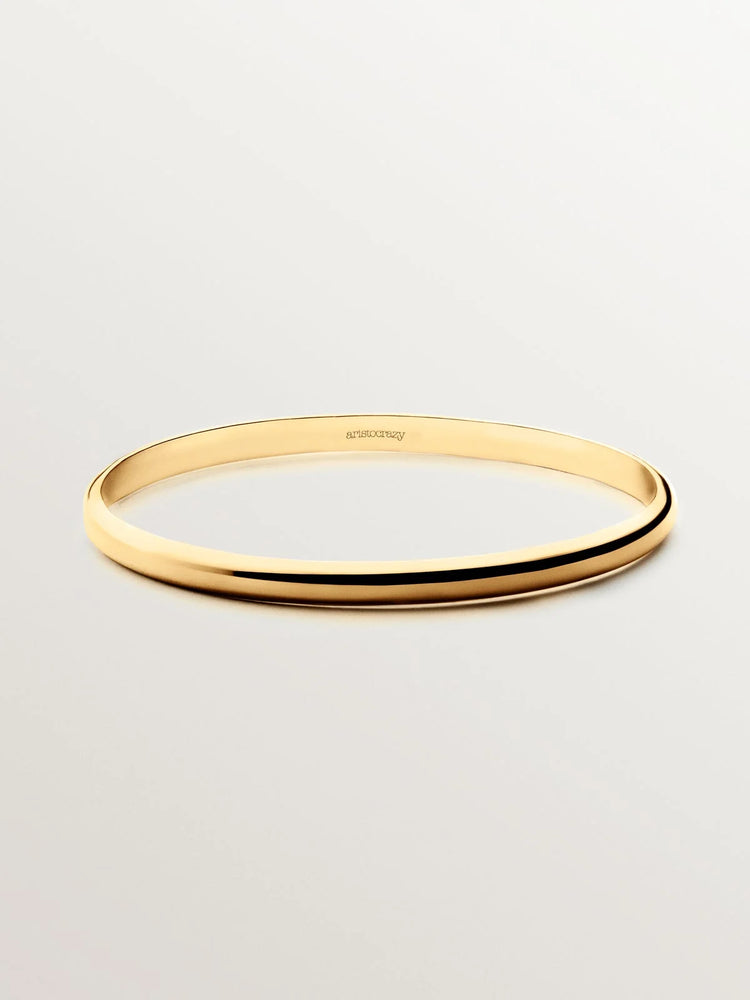 Pulsera rígida estilo semanario de plata 925 bañada en oro amarillo de 18K.